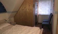 Masterschlafzimmer im Kranich mit Sauna- und Infrarotkabinenkombination