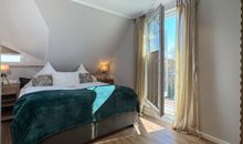 Schlafzimmer mit Balkon
