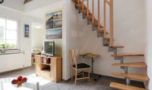 Troja- Wohnbereich mit TV und kleinem Arbeitsplatz