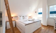 Schlafzimmer 1 im Obergeschoss des Ferienhauses