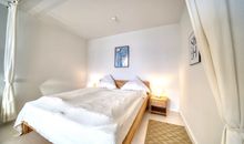 Schlafbereich mit Doppelbett