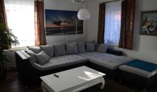Schneckenhaus Ferienhaus - Blick auf das gemütliche Sofa