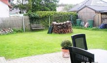 Zum Ferienhaus gehörender eingezäunter Garten