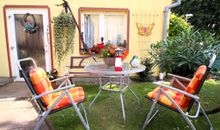 Hausansicht mit Sitzbereich