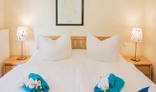 Schlafzimmer mit Zugang zum Balkon