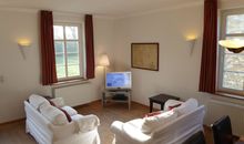 Gut Rattelvitz Parterre A, hochwertig, Sauna, Kamin, eTankstelle, Spielscheune, 15.000qm Parkland